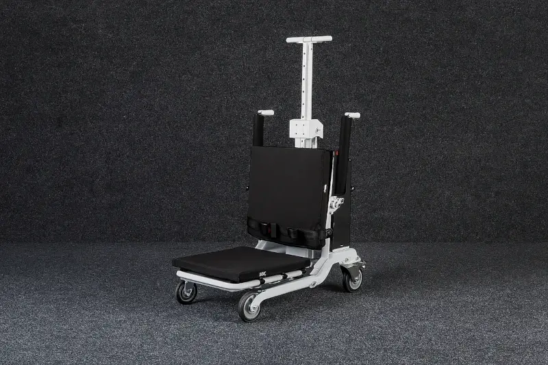 Foldable electric lift chair with smooth wheels and compact design for moving seniors and patients at home