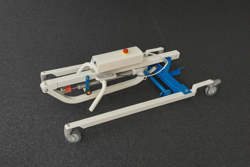 Electric patient hoist folded, with metal frame and castors – easy to transport and store in small spaces