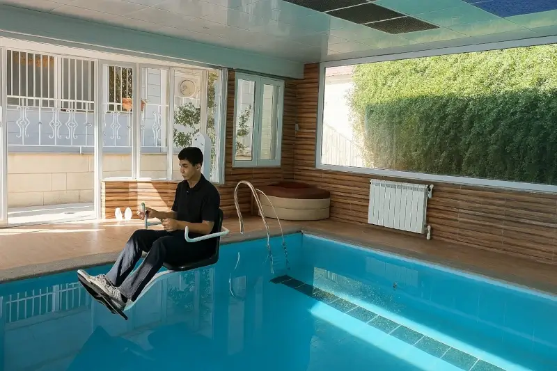 Real use of a pool lift in a residential indoor pool by a user with limited mobility