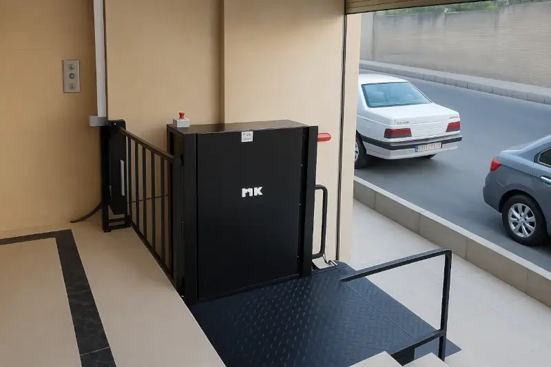 Vertical wheelchair lift for access from parking level to ground floor, suitable for seniors and people with limited mobility